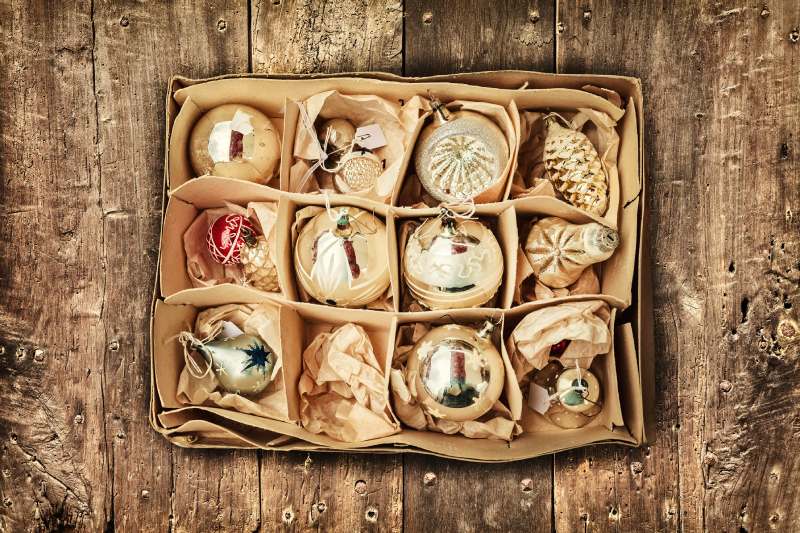 Gold Christmas ornaments stored in a box